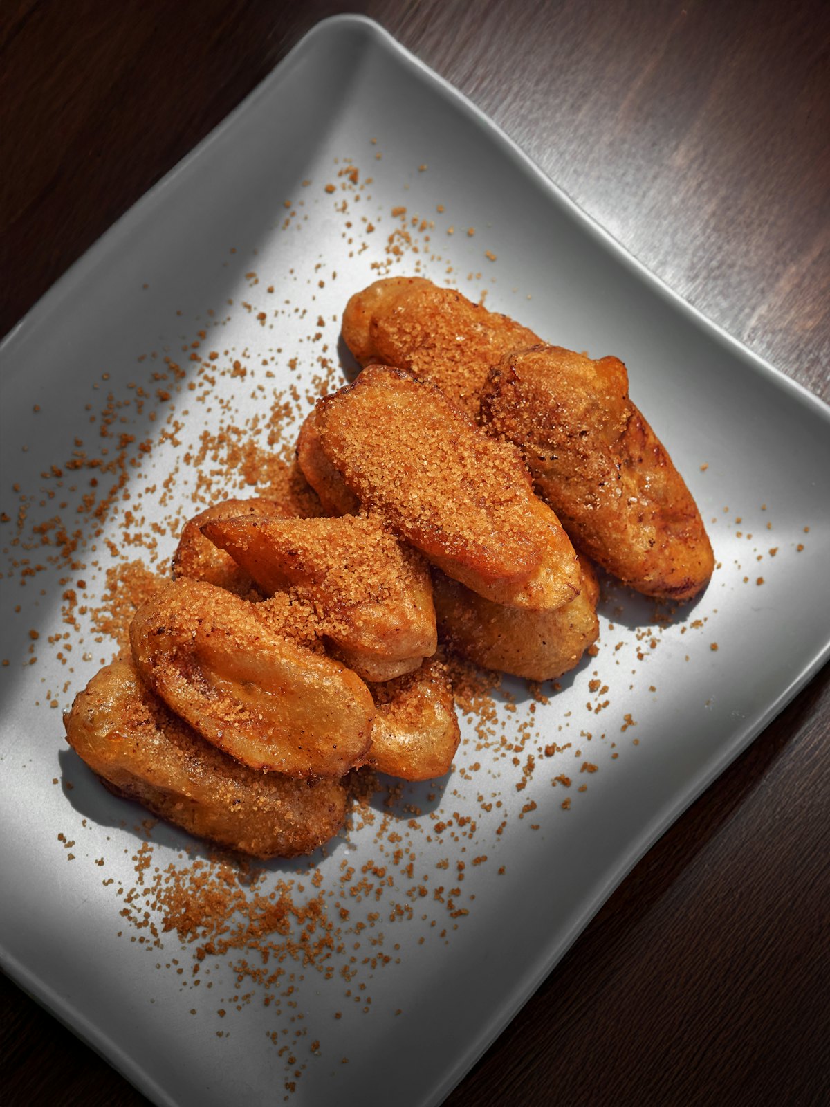 Golden banana fritters on a plate