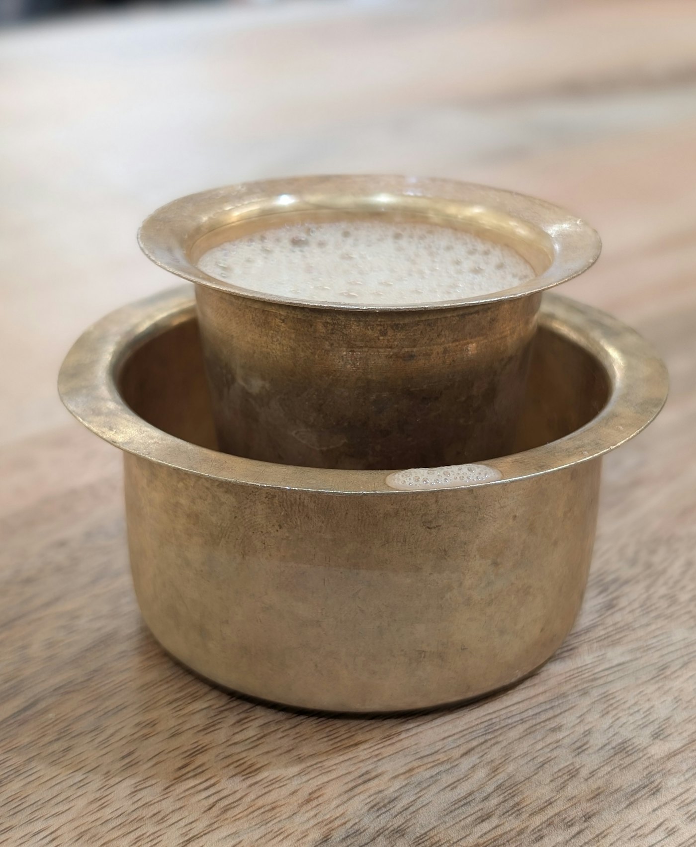 Filter coffee in a brass davara and tumbler